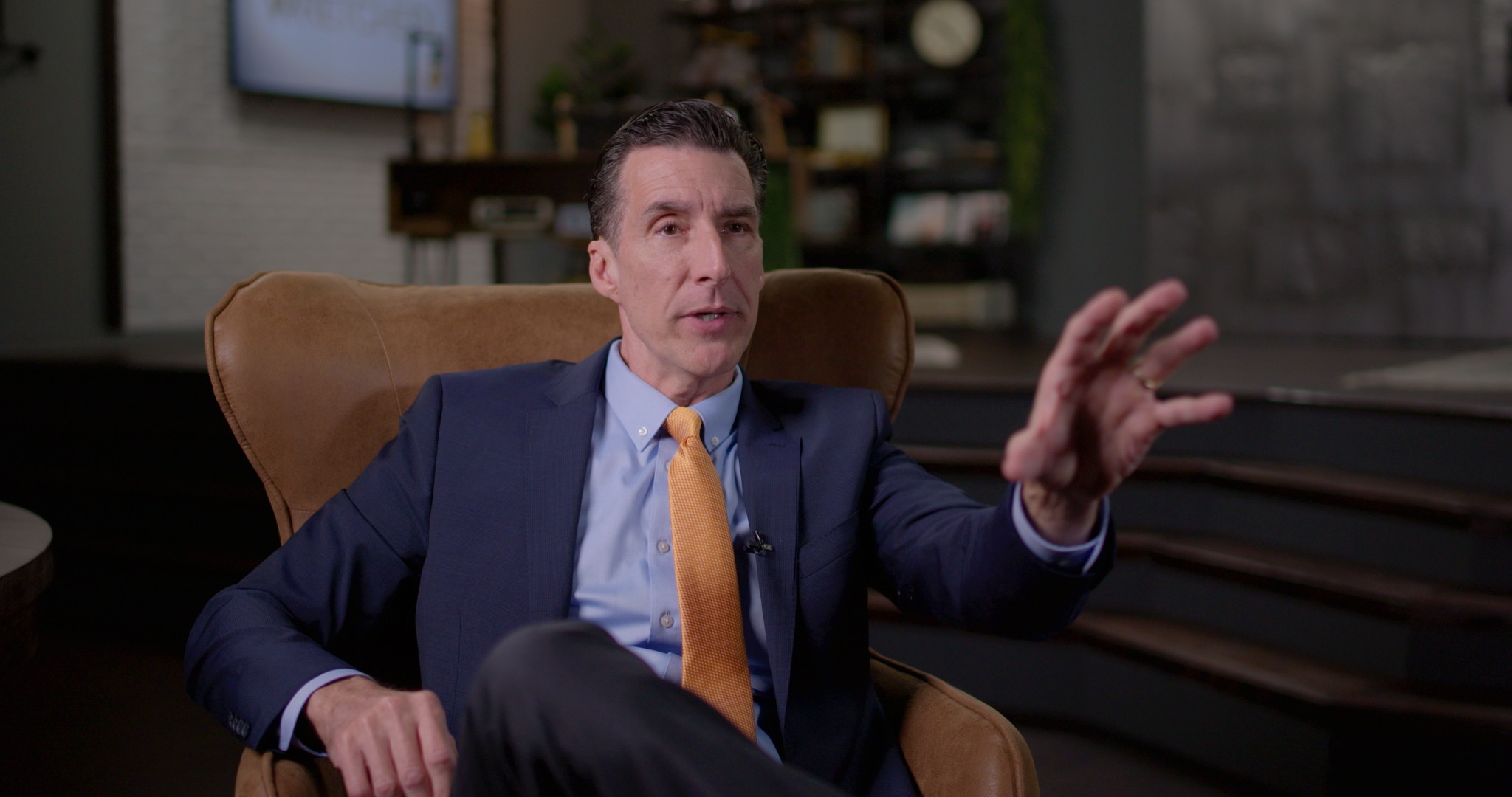 The Todd interview frame with the key light on the camera-facing side of his face—the setup Micah identified as the mistake.